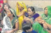  ?? VIPIN KUMAR/HT ?? Relatives at the house in Kishangarh village near Vasant Kunj where the family was found murdered on Wednesday.