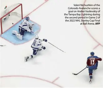  ?? AFP ?? Valeri Nichushkin of the Colorado Avalanche scores a goal on Andrei Vasilevski­y of the Tampa Bay Lightning during the second period in Game 2 of the 2022 NHL Stanley Cup Final at Ball Arena.