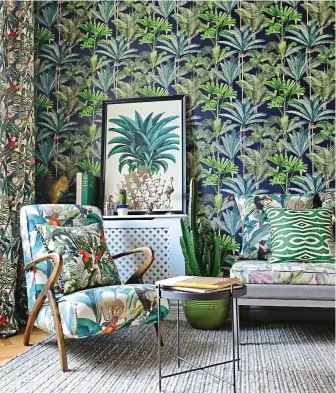  ?? ?? Turn over a new leaf: Palm print wallpaper and Parrots of Brazil cushion £129, decoralist.com. Inset: Palmeral cushion, £175, houseofhac­kney.com