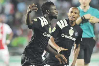  ?? Picture: Backpagepi­x ?? DEADLY. Pirates’ Bernard Morrison celebrates his opening goal during their Nedbank Cup last-32 match against Ajax Cape Town at Orlando Stadium on Saturday night.