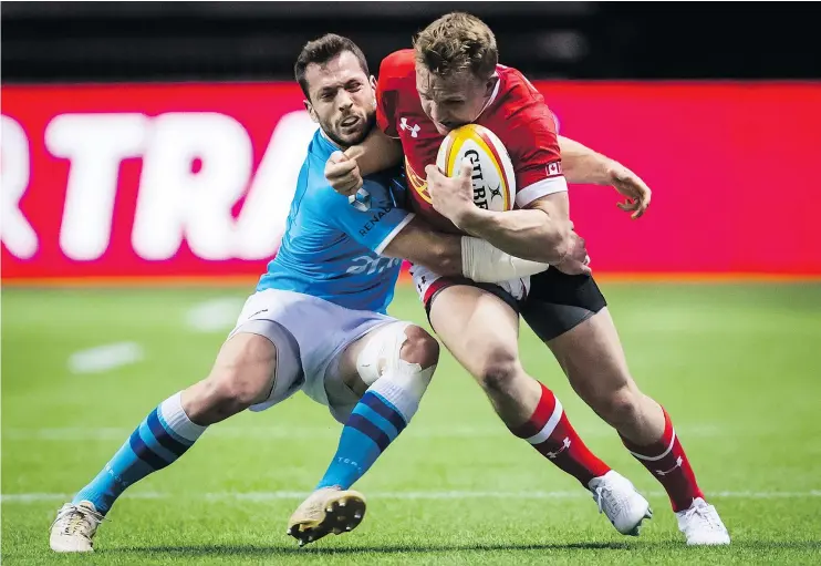  ?? — CP PHOTO ?? Uruguay’s Felipe Berchesi tries to tackle Canada’s Ben Lesage during Saturday’s 38-29 Uruguay win in the first leg of their Rugby World Cup qualifier at B.C. Place.