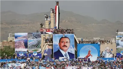  ?? Reuters ?? Supporters of Yemen’s former president Ali Abdullah Saleh at the Unknown Soldier Monument during a rally in Sanaa last month