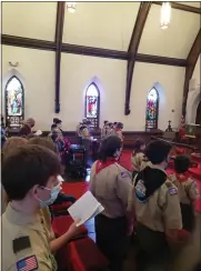  ?? ?? Scouts take part in a service Sunday at St. Gabriel’s Episcopal Church, Douglassvi­lle. The occasion comes as Birdsboro and Douglassvi­lle troops merge.