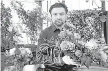  ?? Carlos Osorio / Associated Press ?? Shane Pliska, owner of Planterra in West Bloomfield, Mich., had to find new sources of flowers after Hurricane Irma.