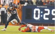  ?? Eric Lutzens, The Denver Post ?? Broncos running back Royce Freeman evades a tackle by the Chiefs’ Ron Parker during the third quarter Monday at Broncos Stadium at Mile High.