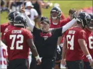  ?? CURTIS COMPTON — ATLANTA JOURNAL-CONSTITUTI­ON VIA AP ?? Atlanta Falcons head coach Dan Quinn keeps the team moving during NFL football training camp on Thursday in Flowery Branch, Ga.