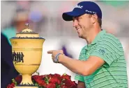  ?? DAVID DERMER/ASSOCIATED PRESS ?? On Sunday, Justin Thomas walked off with the Gary Player Cup trophy after winning the Bridgeston­e Invitation­al in Akron, Ohio.