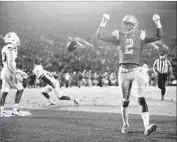  ?? Sean M. Haffey Getty Images ?? JORDAN LASLEY, celebratin­g a score Saturday, has been involved in several trick plays this year.