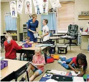  ?? BECKEL, THE OKLAHOMAN ARCHIVES] [PHOTO BY JIM ?? Teacher Carri Hicks interacts with students at Grove Valley Elementary School in the Deer Creek district.