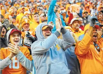  ?? STAFF FILE PHOTO BY DOUG STRICKLAND ?? Tennessee fans cheer after a touchdown during the Volunteers' game against the Missouri Tigers this past November at Neyland Stadium in Knoxville. Tennessee's men's programs strugged throughout the 2016-17 athletic calendar, and as a result, they were...