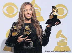  ??  ?? Beyonce poses with her three Grammys.