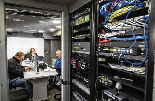  ?? PHOTOS BY JOHNNY MILANO/THE NEW YORK TIMES ?? Lisa Black, chief deputy county executive for Suffolk County, N.Y., works in a mobile command post with secure internet. For weeks this fall, Suffolk County returned to the analog world of the 1990s after a malicious ransomware attack forced it largely offline.