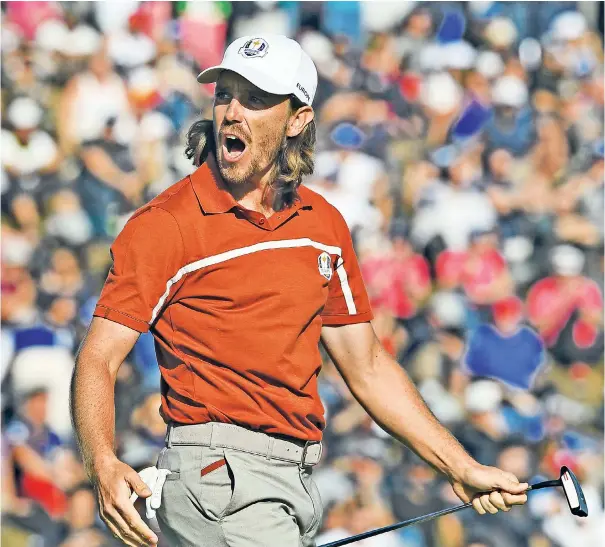  ??  ?? Fired up: Tommy Fleetwood celebrates sinking a putt during his historic day with Francesco Molinari – the duo became the first European partnershi­p to win all four of their matches