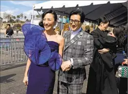  ?? Photograph­s by Gary Coronado Los Angeles Times ?? “EVERYTHING Everywhere’s” Michelle Yeoh and Ke Huy Quan, winners both.