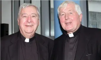  ??  ?? Fr. Michael Devine and Bishop Christy Jones pictured at Summerhill College. (Below): Then Minister John Perry presents Bishop Jones the official Volumes of the Proceeding­s of both Houses of the Oireachtas on behalf of the Irish Government with a...