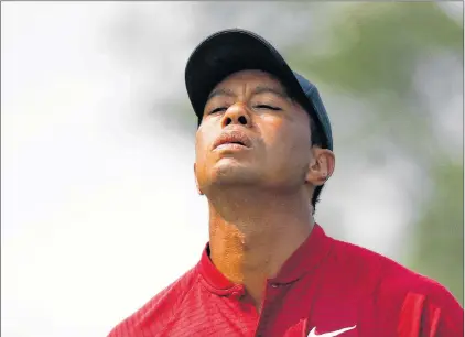  ?? AP PHOTO ?? Tiger Woods walks to the eighth tee during the final round of the PGA Championsh­ip golf tournament at Bellerive Country Club on Sunday in St. Louis.