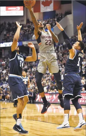  ?? Brad Horrigan / TNS ?? UConn’s Terry Larrier (center) drives to the basket between Villanova’s Omari Spellman (left) and Jalen Brunson on Jan. 20.