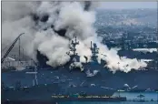  ?? DENIS POROY — THE ASSOCIATED PRESS FILE ?? Smoke rises from the USS Bonhomme Richard at Naval Base San Diego in San Diego after an explosion and fire onboard the ship.