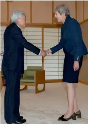  ?? — AFP ?? Japanese Emperor Akihito and Britain’s Prime Minister Theresa May shake hands at the Imperial Palace in Tokyo on Friday.