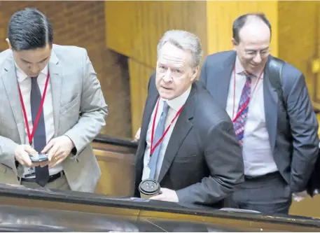  ?? RYAN REMIORZ/THE CANADIAN PRESS ?? Canada’s chief NAFTA negotiator Steve Verheul, centre, leaves for the lunch break at the sixth round of the North American Free Trade Agreement, Thursday, January 25, in Montreal.