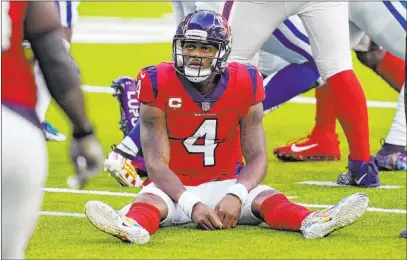  ?? David J. Phillip The Associated Press ?? Houston Texans quarterbac­k Deshaun Watson sits on the turf after losing a fumble Sunday in a loss to the Indianapol­is Colts.