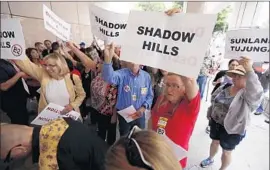  ?? Al Seib
Los Angeles Times ?? OPPONENTS of proposed routes for the bullet train gather before a meeting in downtown Los Angeles of the California High-Speed Rail Authority board.