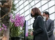  ?? EVELYN HOCKSTEIN—ASSOCIATED PRESS ?? U.S. Vice President Kamala Harris, accompanie­d by Gardens by the Bay CEO Felix Loh, visits the orchid that was named after her, at the Flower Dome at Gardens by the Bay, following her foreign policy speech in Singapore, Tuesday, Aug. 24, 2021.