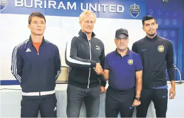  ??  ?? Malaysia head coach Nelo Vingada (second right) shakes hands with his North Korea counterpar­t Jorn Andersen during the press conference in Buriram, Thailand. — Bernama photo