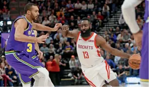  ?? AP ?? James Harden drives around Utah Jazz’s Rudy Gobert. —