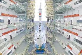  ?? WANG JIANGBO/XINHUA VIA AP, FILE ?? The Shenzhou-13 manned spaceship onto of a Long March-2F carrier rocket prepares to be transferre­d to the launching area of Jiuquan Satellite Launch Center in northweste­rn China.