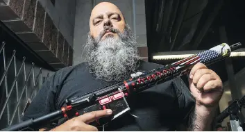  ??  ?? Jerry Lema, a registered firearms dealer based in Idaho who customizes rifles based on the AR-15 platform, is a firm believer in America’s Second Amendment, but is also a stickler when it comes to the rules for selling guns.