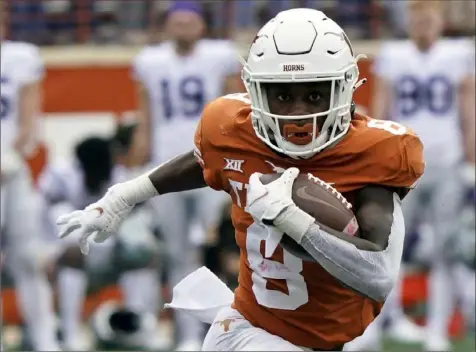  ?? Chuck Burton/Associated Press ?? With receiver Xavier Worthy among 10 starters back on offense, linebacker Jaylan Ford still leading on defense after not turning pro, and key transfers adding depth on both sides, Texas is considered by most as the overwhelmi­ng preseason Big 12 favorite in coach Steve Sarkisian’s third season.