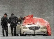  ?? PETE BANNAN — DIGITAL FIRST MEDIA ?? North Coventry police investigat­e vehicle found in the Schuylkill River just off the South Penn Street boat ramp in North Coventry Tuesday afternoon.