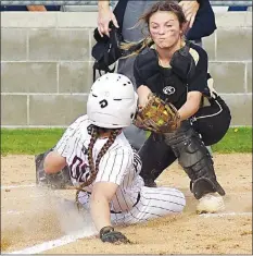  ?? Westside Eagle Observer/RANDY MOLL ?? Gentry junior Maddi Voyles slides across home plate just ahead of the West Fork catcher’s tag for another of Gentry’s 15 runs in the Lady Pioneer home victory on Thursday.