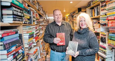  ?? BOB TYMCZYSZYN TORSTAR ?? The basement of Don and Jennifer Longmuir’s home in St. Catharines houses 13,000 books. Through their Scene of the Crime Books, they distribute worldwide.