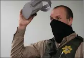  ?? ALAN DEP — MARIN INDEPENDEN­T JOURNAL ?? Deputy Braeden Ross takes off virtual reality goggles after trying a new training program for crisis response at the Marin County Sheriff’s Office in San Rafael on Thursday.