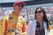  ?? JARED C. TILTON, GETTY IMAGES ?? Joey Logano and wife Brittany, shown before Sunday’s Cup race, announced Brittany’s pregnancy after the race.
