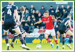  ??  ?? DEFLECTION: Jerry Yates scores Swindon’s second