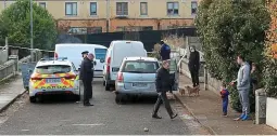  ??  ?? Shooting scene: Gardaí at the Mulhuddart housing estate