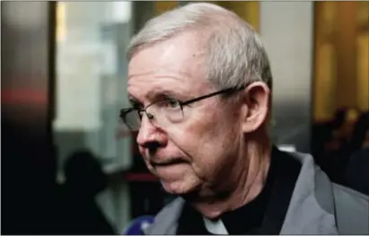  ?? THE ASSOCIATED PRESS FILE ?? In this file photo, Monsignor William Lynn leaves a bail hearing at the Center for Criminal Justice in Philadelph­ia. The church official is hoping to be released on bail while awaiting a decision from the district attorney as to whether he will face...