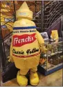  ?? BILL RETTEW/MEDIANEWS GROUP ?? Who wouldn’t want to dress up as a mustard bottle at the National Mustard Museum in Madison, Wisconsin?