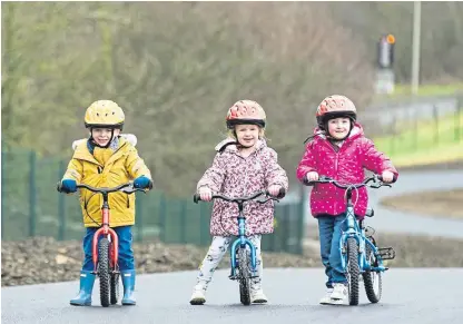  ??  ?? Three youngsters enjoying riding their bikes in safety at Fife Cycle Park.