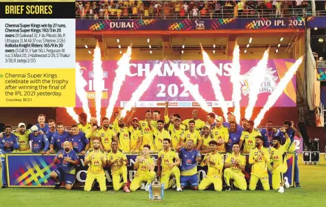  ?? Courtesy: BCCI ?? ■ Chennai Super Kings celebrate with the trophy after winning the final of the IPL 2021 yesterday.