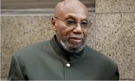  ?? Photograph: Seth Wenig/AP ?? Muhammad Aziz talks outside the courthouse with members of his family after his conviction in the killing of Malcolm X was vacated on Thursday.