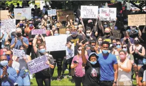  ?? Christian Abraham / Hearst Connecticu­t Media ?? Over 1,000 people gather to protest police brutality and hear calls for peace during a rally held on the Trumbull Green on Saturday.