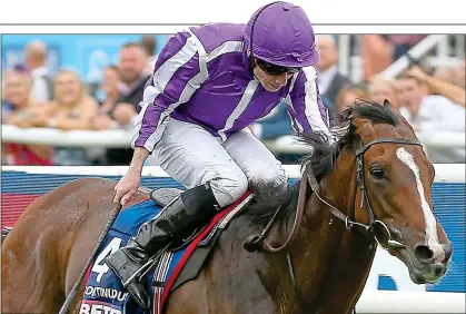  ?? ?? IN FORM: Ryan Moore steers Continuous to St Leger success last month