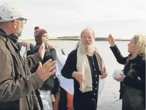  ??  ?? Life’s a beach: Sunset Song actor Peter Mullan, centre, on set in St Andrews for the filming of Tommy’s Honour.