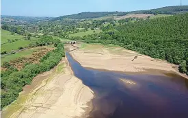  ??  ?? Heat is on: Low water levels at Lindley Wood Reservoir as suppliers struggle