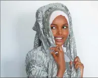  ?? BRENDAN MCDERMID / REUTERS ?? Fashion model and former refugee Halima Aden breaks boundaries as the first hijab-wearing model gracing magazine covers and walking in high profile runway shows.