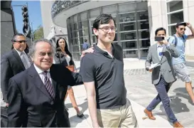  ?? Seth Wenig / Associated Press ?? Martin Shkreli, center, with lawyer Benjamin Brafman, leaves federal court Friday in New York. He was convicted on three of eight counts in his fraud case.